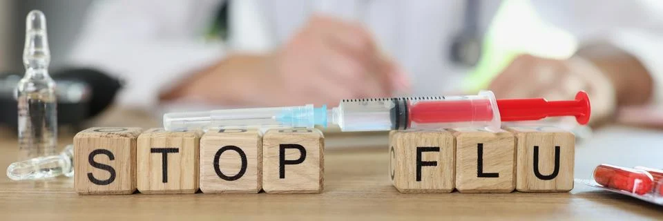 Stop flu word on table collected of wooden cubes Stock Photos