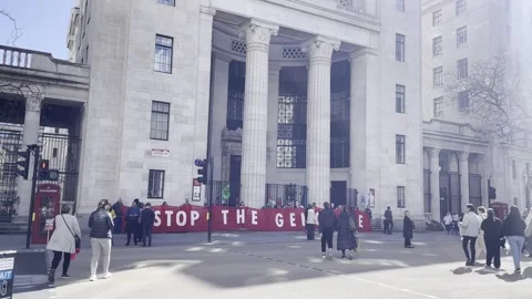 "Stop the genocide" banner in protest against Israel Stock Footage 270971478