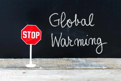 STOP GLOBAL WARMING message written on chalkboard Stock Photos