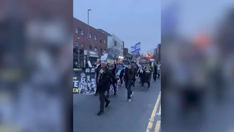 Stop The Hate campaign group marches through Golders Green following arson atta Stock Footage 331318486