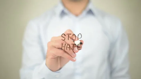Stop Hate , man writing on transparent screen Video stock 62757664