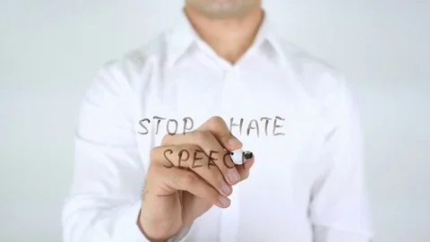 Stop Hate Speech, Man Writing on Glass Stock Footage 77971891