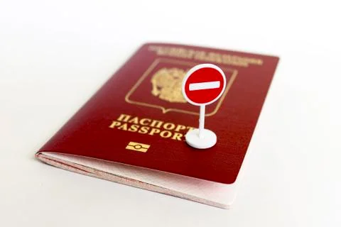 Stop illegal migration concept, Russian passport and stop sign close up. Stock Photos