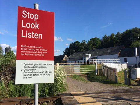 Stop look listen, railway level crossing sign, Inverness, Scottish Highlands Stock Footage 76798715