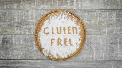 Stop motion animation of appearance "gluten free" inscription on flour Stock Footage 104858154