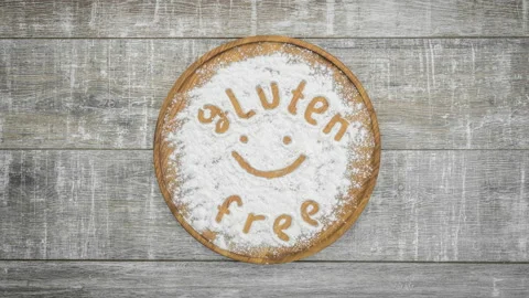 Stop motion animation of appearance "gluten free" inscription on flour Stock Footage 104858339