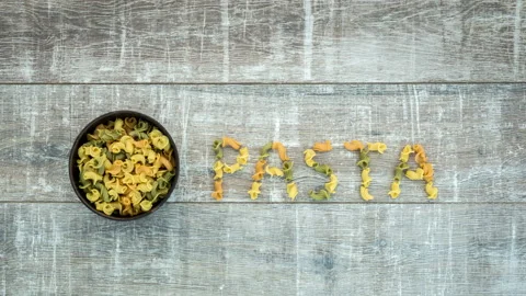 Stop motion animation of appearance "pasta" inscription Stock Footage 104858440