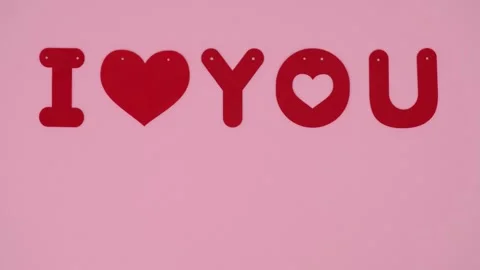 Stop motion animation of appearing words I love you with heart shape. Stock Footage 261827539