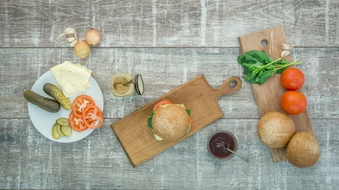 Stop motion animation of burger cooking, top view, 4k Stock Footage 104858036