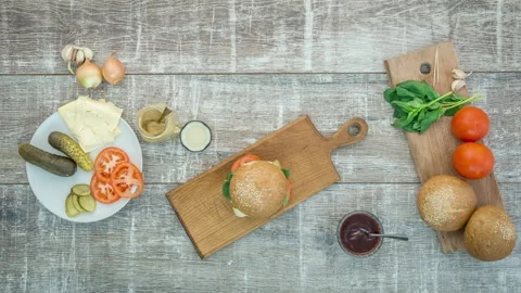 Stop motion animation of burger cooking, top view, 4k Stock Footage 104906889