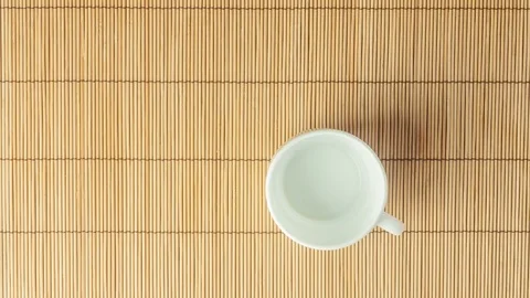 Stop motion, animation. A cake on a plate and a cup of black natural coffee Stock Footage 103533337