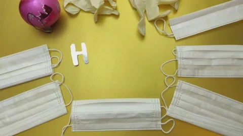 Stop motion animation with Christmas tree balls and protective masks Stock-Footage 143198295