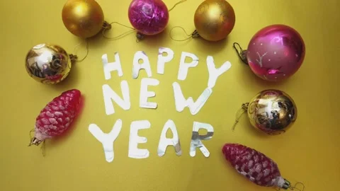 Stop motion animation with Christmas tree balls and Happy New Year greetings Stock-Footage 143198457