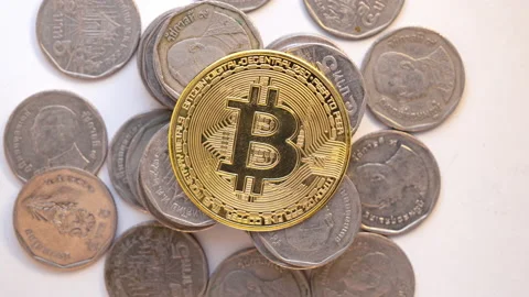 Stop motion animation coins decreasing and increasing pile of coins with Bitcoin Video stock 184205831