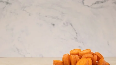 Stop motion animation of cutting fresh and organic carrot Stock Footage 115049197