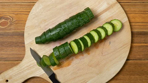 Stop motion animation of cutting fresh cucumber Stock Footage 163160383