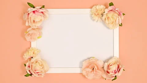 Stop motion animation of decorating white frame with pastel flowers Stock Footage 166373357