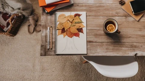 Stop motion animation drawn on a paper a tree comes to life and leaves fall off Stock Footage 128163927