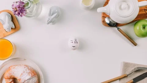 Stop motion animation, easter egg on the table, male hand catches an egg, the eg 動画素材 128163944