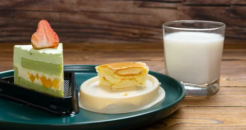 Stop motion animation of eating cheese cake and strawberry cake Stock Footage 163873545