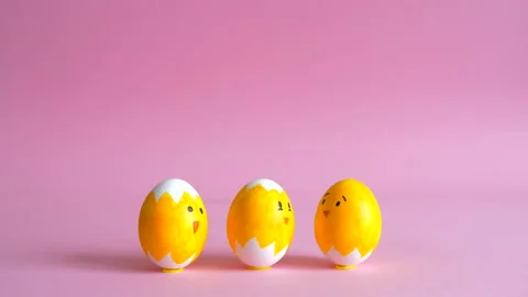 Stop motion animation of festive Easter eggs on a pink background Stock Footage 149604025