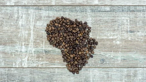 Stop motion animation of formation figure of african continent from coffee beans Stock Footage 105305208