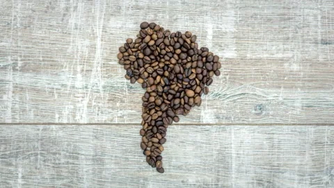 Stop motion animation of formation figure of south america from coffee beans Stock Footage 105306446