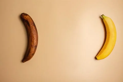 Stop motion animation of fresh and rotten banana on beige background. Stock Footage 285252331