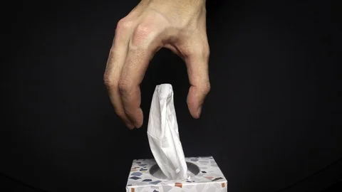 Stop Motion Animation. Hand taking a tissue from a tissues box Stock Footage 124264649