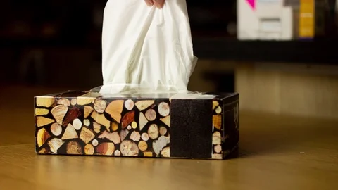 Stop motion animation. Hand taking a tissue from a tissues box Stock Footage 125478006