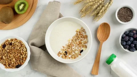 Stop motion animation of healthy breakfast consisting of natural yogurt with Stock Footage 169861784