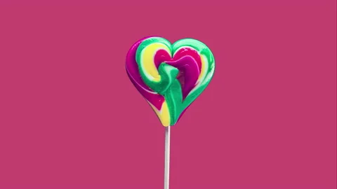 Stop motion animation lollipops on a modern background. Sweet candy spiral heart Stock Footage 165627689
