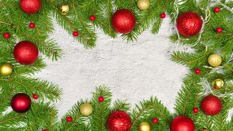 Stop motion animation of making Christmas frame with branches and ornaments Stock Footage 163218800