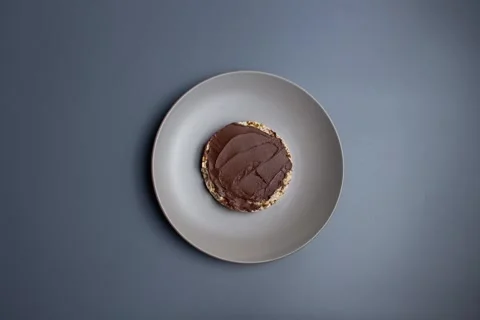 Stop motion animation of making crisp toast with chocolate spread and banana Stock Footage 285252326