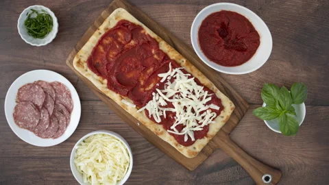 Stop Motion Animation of Making a Pepperoni Flatbread Pizza Stock Footage 162975408