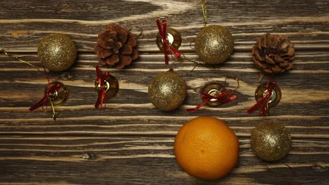 Stop motion animation. Mandarin duck eats Christmas tree toys on a wooden bac Stock Footage 143003490