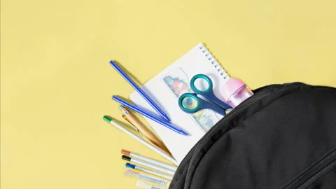 Stop motion animation of Multicolor school supplies moving from school backpack Stock Footage 278665638