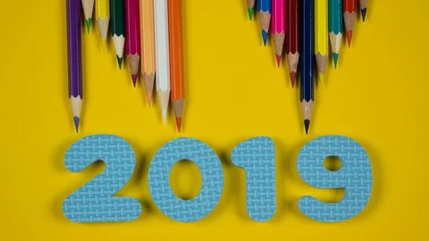 Stop motion animation of multicolored pencils on a yellow background Video stock 96525346