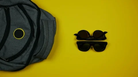 Stop motion animation of packing  things for travel. Preparation for vacation Stock Footage 91829981