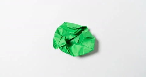 Stop motion animation paper wrinkles making a paper ball, green and white color Stock Footage 128243134