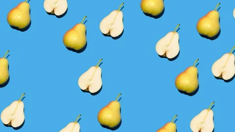 Stop motion animation of pears filling the blue background one by one Stock Footage 267943733