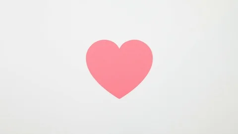 Stop Motion Animation Pink Paper Heart Uncrumples and Beats - Looping Stock Footage 100995141