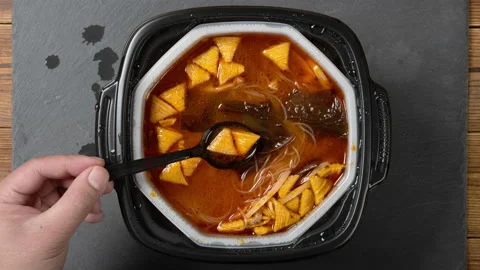 Stop motion animation of preparing and eating self-cooking hotpot with noodle Stock Footage 166984670
