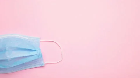 Stop motion animation protective mask on pink background Stock Footage 142064939