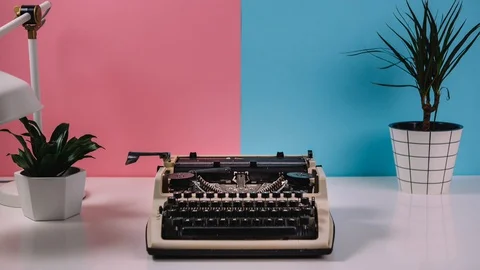 Stop motion animation, retro typewriter prints flowers, female hand picks up a b Stock Footage 128163950