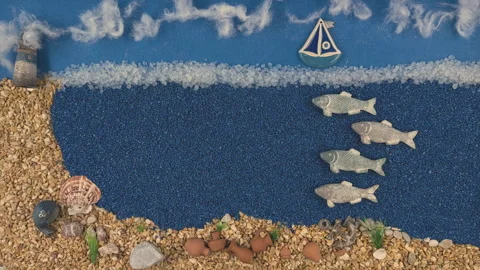 Stop Motion Animation of Stone Fish and Sailing Boat in a Blue Stone Sea Video stock 327078230