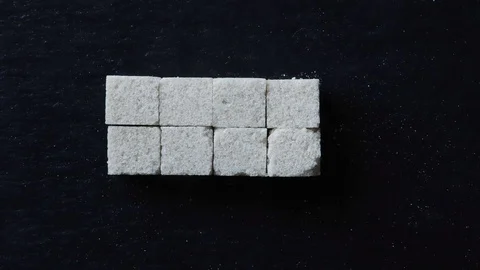 Stop motion animation of sugar cubes for food background Stock Footage 125442914