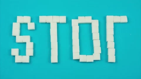 Stop motion Animation of sugar cubes, the word "stop", Stock Footage 136849340