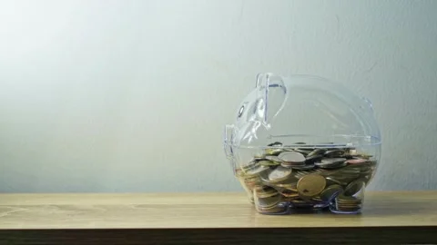 Stop motion animation thai baht coin into clear piggy bank Stock Footage 162293777