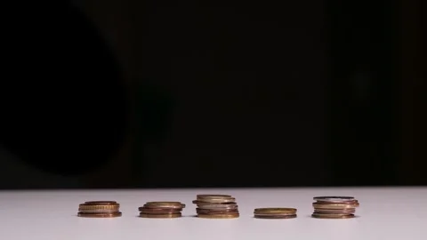 Stop motion animation timelaps Raising of coins stacks on Black background Stock Footage 258515134